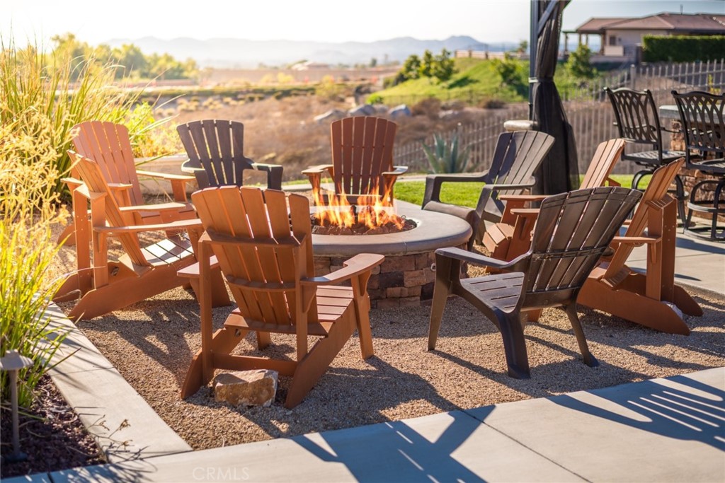 845 Alpine Meadows Lane Riverside, CA 92506 - Photo 21 of 57 a view of a chairs and table on the terrace
