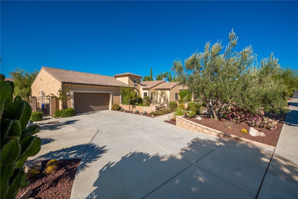 845 Alpine Meadows Lane Riverside, CA 92506 - Photo 25 of 57 a front view of a house with a yard