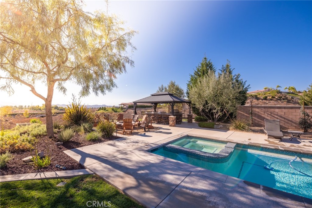 845 Alpine Meadows Lane Riverside, CA 92506 - Photo 27 of 57 a view of a backyard with sitting area