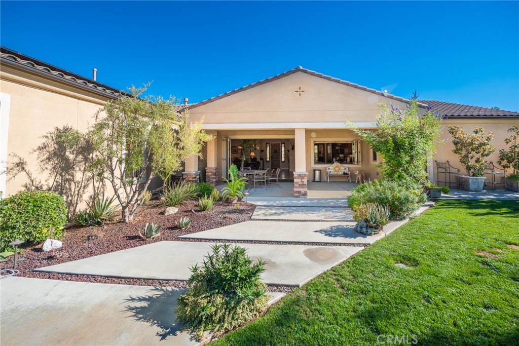 845 Alpine Meadows Lane Riverside, CA 92506 - Photo 29 of 57 a front view of a house with garden