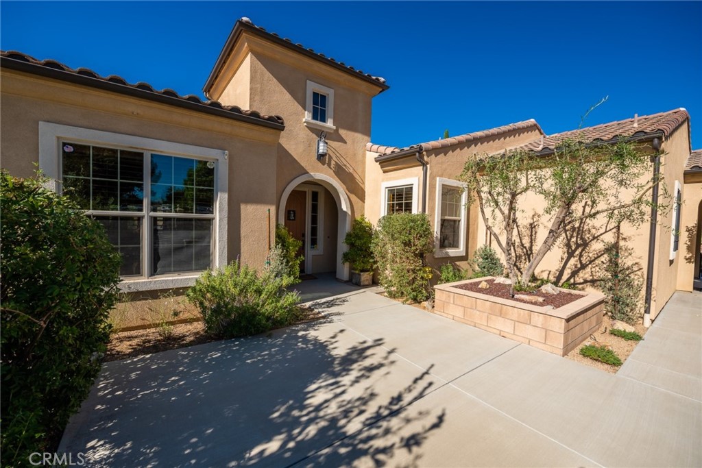 845 Alpine Meadows Lane Riverside, CA 92506 - Photo 31 of 57 a front view of a house with garden