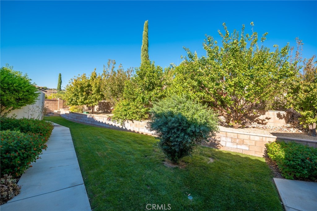 845 Alpine Meadows Lane Riverside, CA 92506 - Photo 38 of 57 a view of a garden with a building in the background