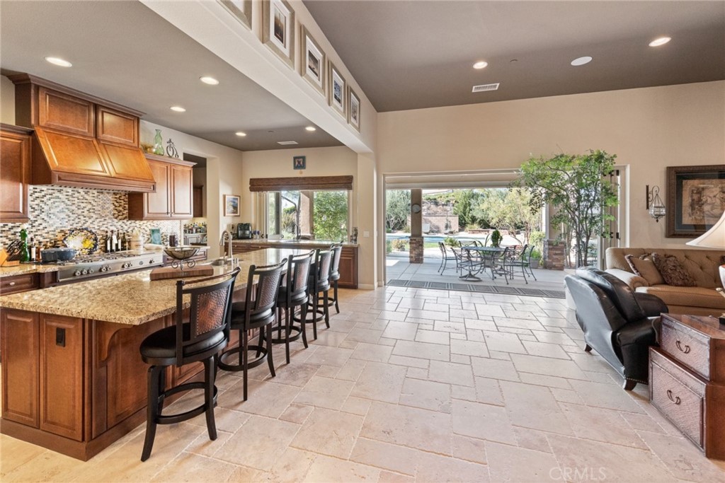 845 Alpine Meadows Lane Riverside, CA 92506 - Photo 41 of 57 a large hall with dining table and chairs