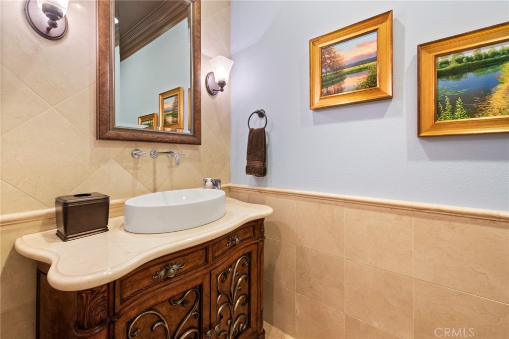 845 Alpine Meadows Lane Riverside, CA 92506 - Photo 48 of 57 a bathroom with a sink vanity and a mirror