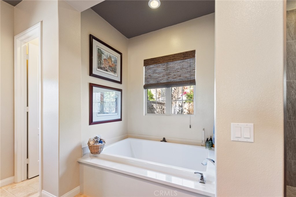 845 Alpine Meadows Lane Riverside, CA 92506 - Photo 53 of 57 a bathroom with a bathtub and a window