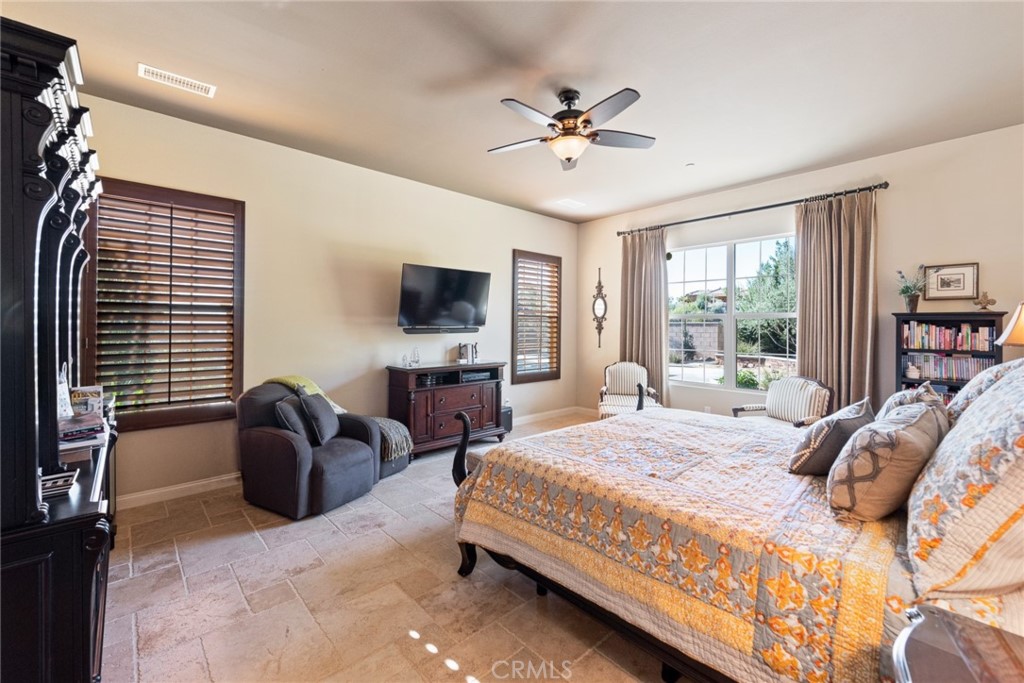 845 Alpine Meadows Lane Riverside, CA 92506 - Photo 55 of 57 a bedroom with a bed a couch and dresser