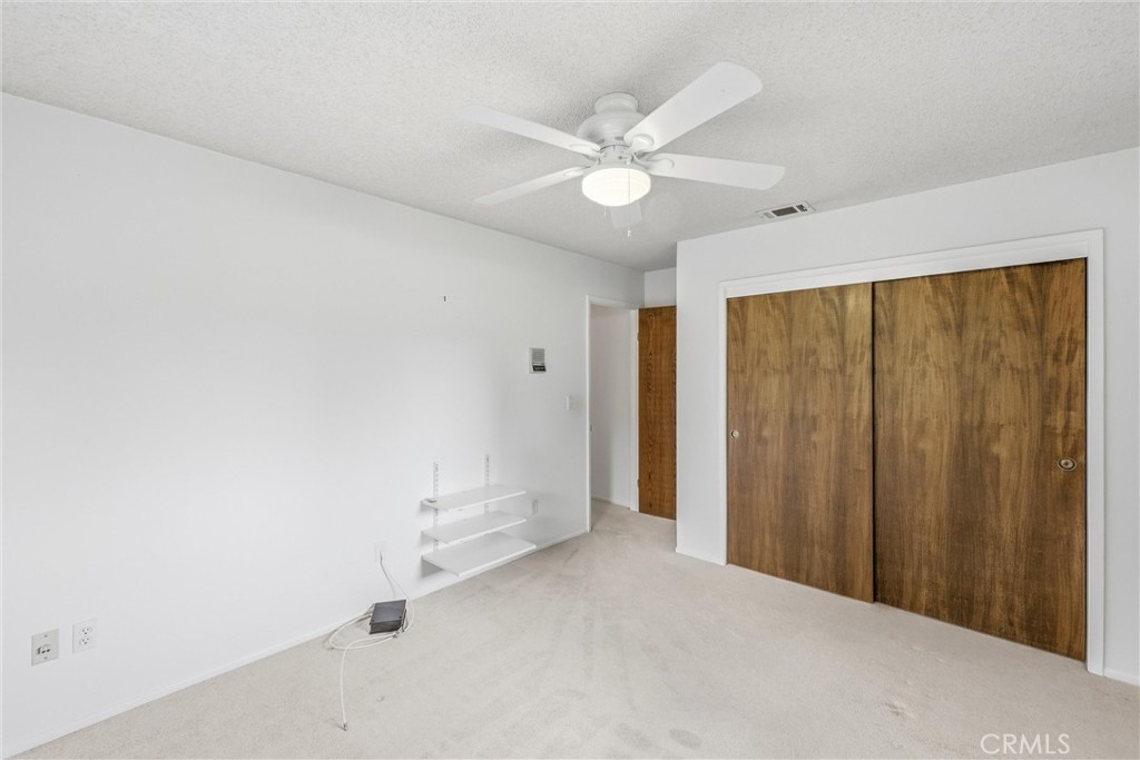 37295 Oak View Road Yucaipa, CA 92399 - Photo 38 of 59 a view of a livingroom with a ceiling fan and window