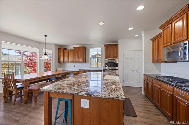 a front view of house with yard and outdoor seating