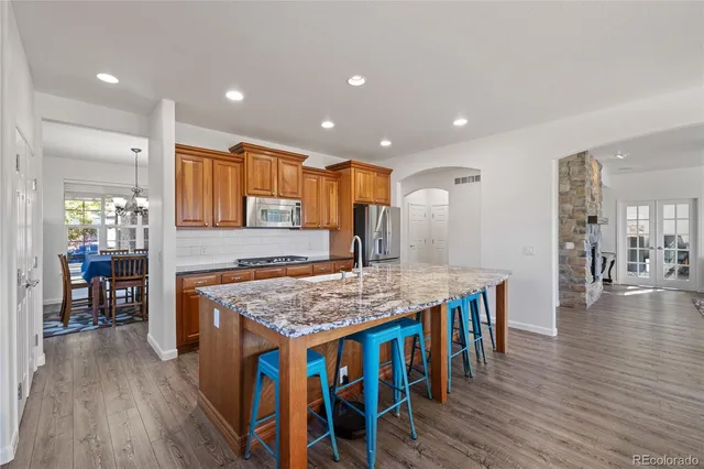 a view of a house with backyard porch and sitting area