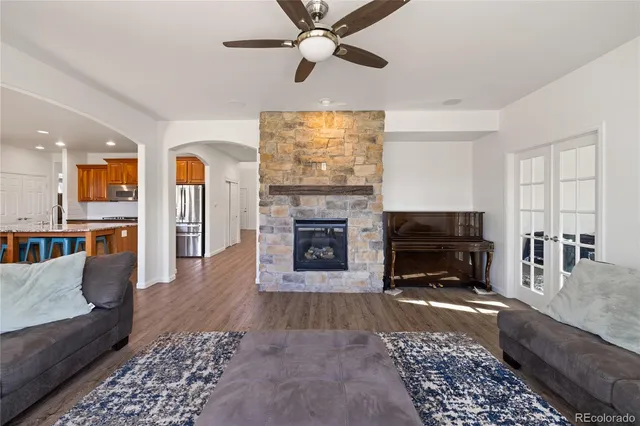 a view of a house with a yard patio and fire pit
