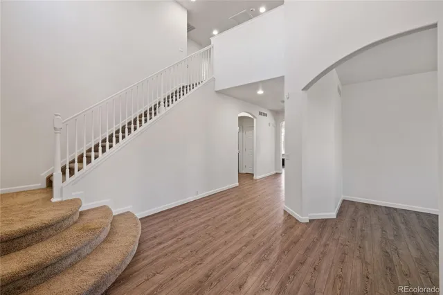 a kitchen with stainless steel appliances granite countertop a stove and cabinets