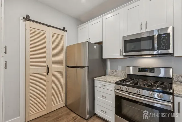 a kitchen with appliances and cabinets