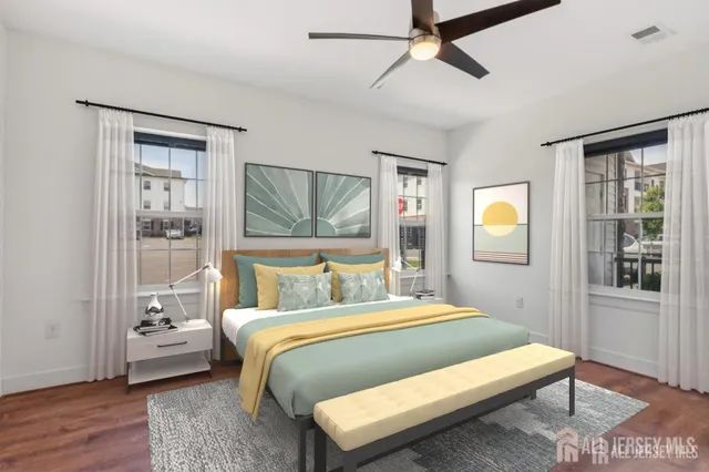 a bedroom with a bed lamp and a window