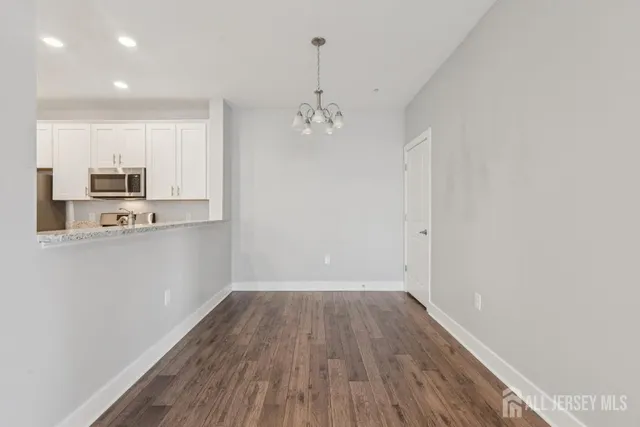 a view of a kitchen with electric appliances