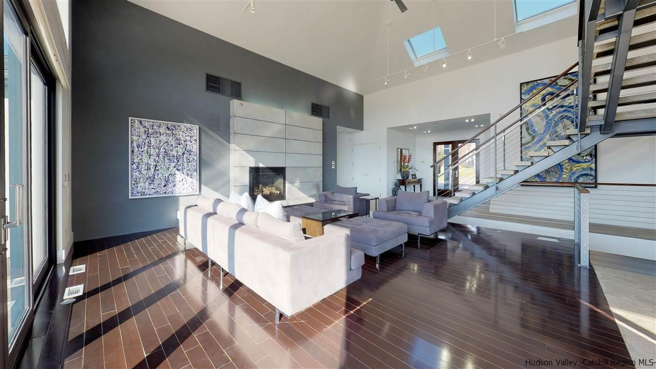 44 Willow Brook Road, Unit 3 799 000 Stanford, NY 12514 - Photo 11 of 18 a living room with fireplace furniture and a wooden floor
