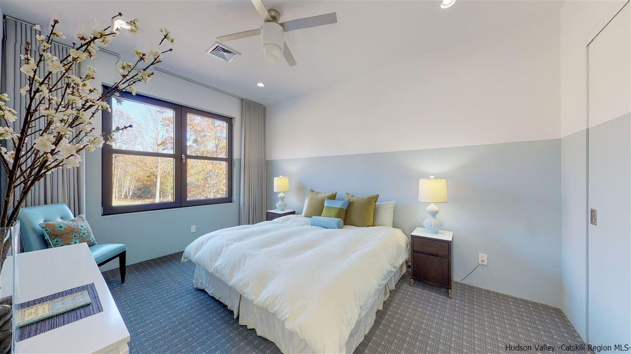 44 Willow Brook Road, Unit 3 799 000 Stanford, NY 12514 - Photo 14 of 18 a bedroom with a large bed and a window