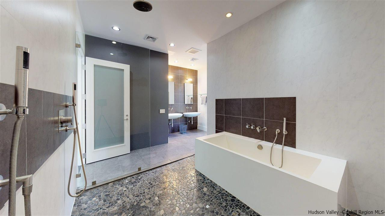 44 Willow Brook Road, Unit 3 799 000 Stanford, NY 12514 - Photo 17 of 18 a bathroom with a bathtub and a sink