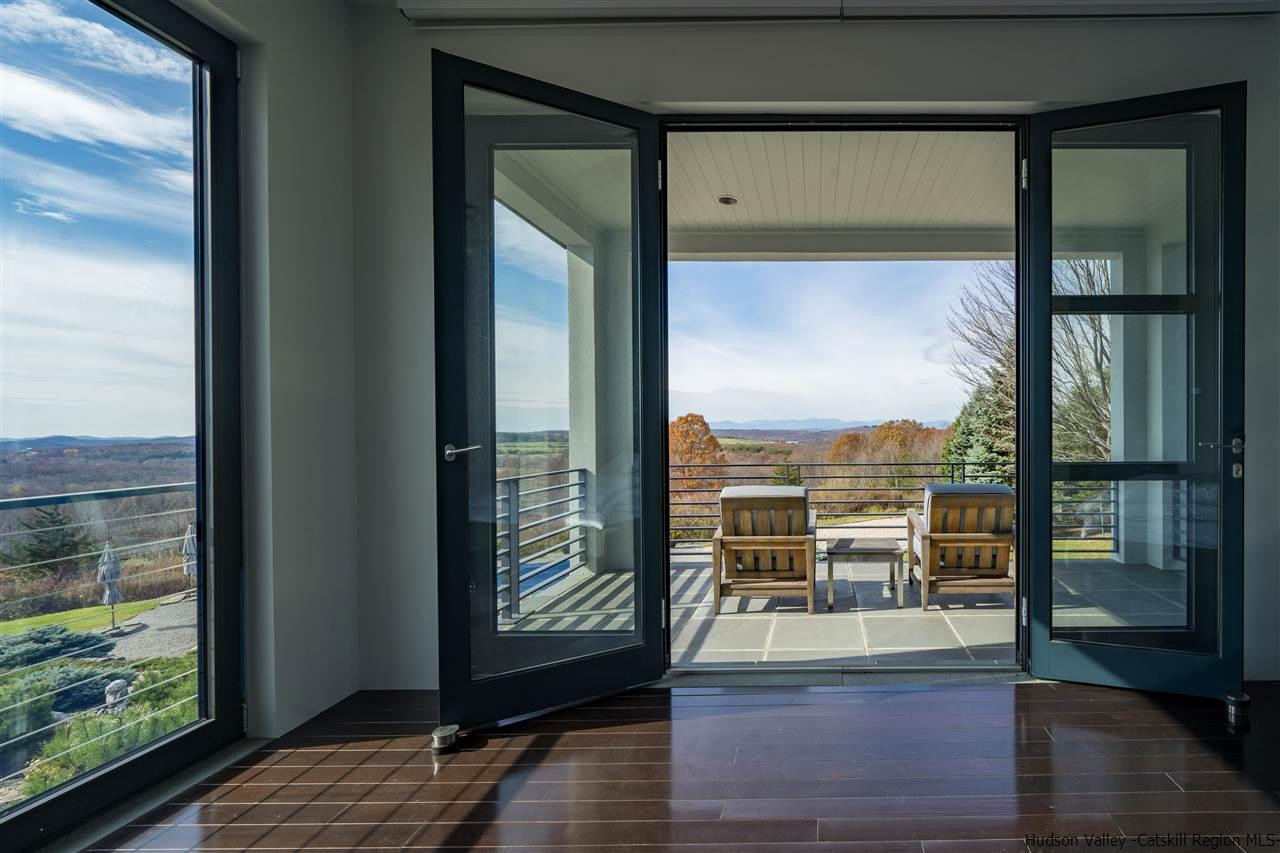 44 Willow Brook Road, Unit 3 799 000 Stanford, NY 12514 - Photo 3 of 18 a living room with hardwood floor and a large window