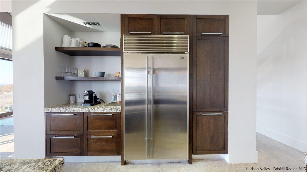 44 Willow Brook Road, Unit 3 799 000 Stanford, NY 12514 - Photo 6 of 18 a kitchen with stainless steel appliances granite countertop a refrigerator and a sink