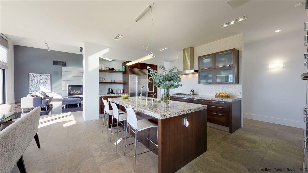 44 Willow Brook Road, Unit 3 799 000 Stanford, NY 12514 - Photo 8 of 18 a living room with stainless steel appliances kitchen island granite countertop furniture and a large window