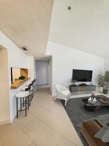 an aerial view of residential houses with outdoor space and lake view