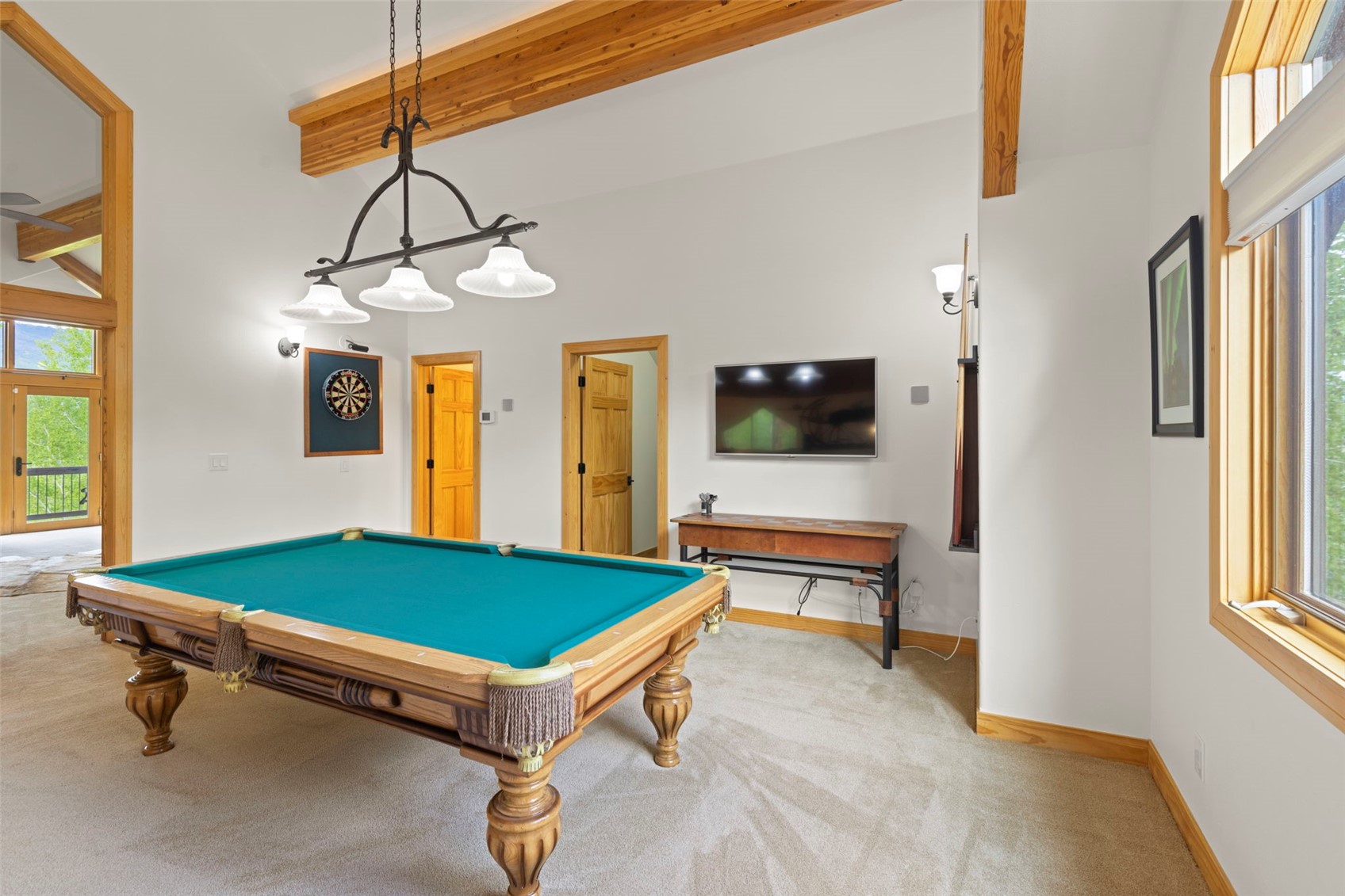 736 Wild Rose Road Silverthorne, CO 80498 - Photo 21 of 49 Game room with beamed ceiling, plenty of natural light, light carpet, billiards, and a towering ceiling