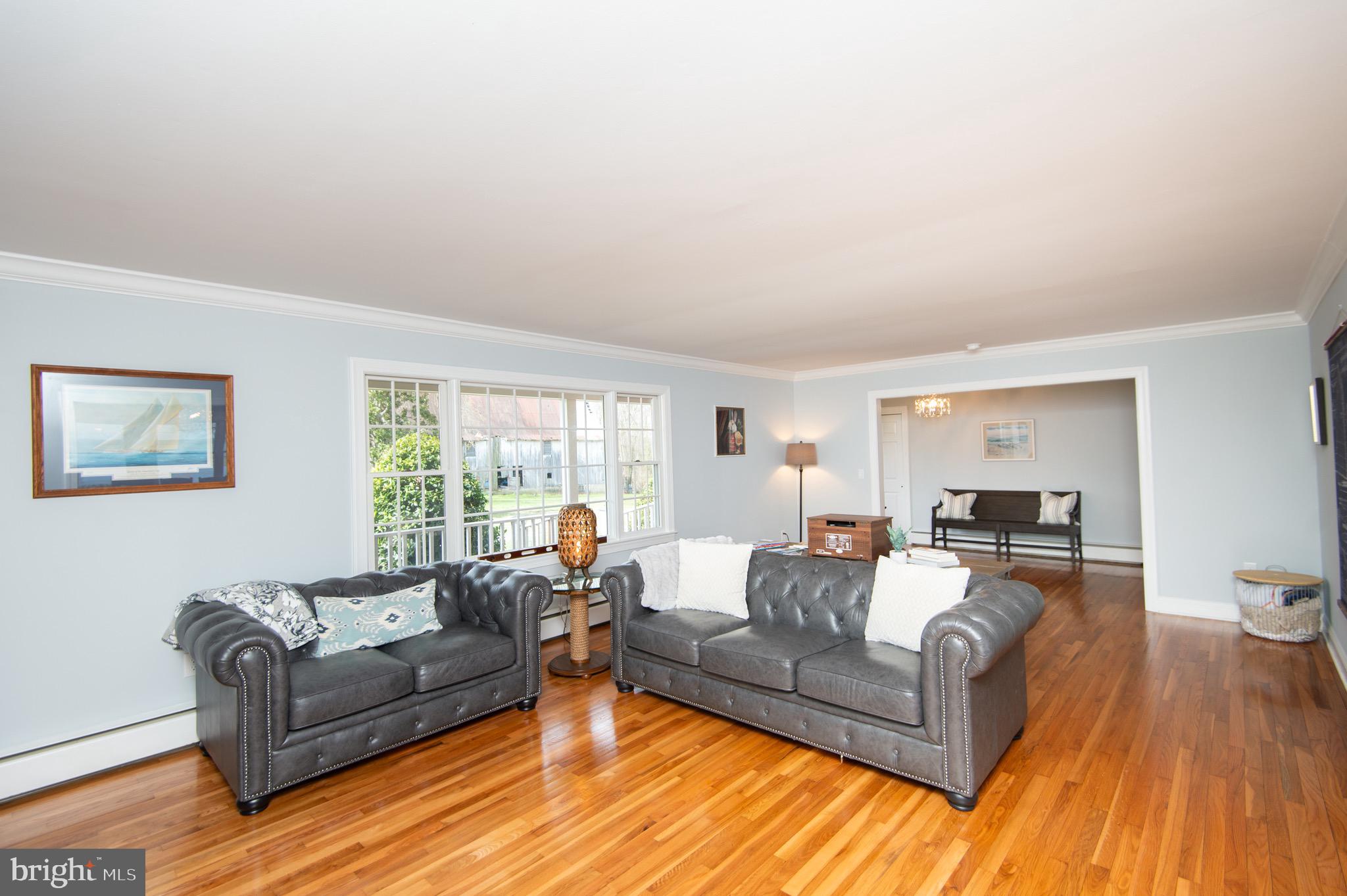 1417 School Street Cambridge, MD 21613 - Photo 12 of 73 a living room with furniture and a large window