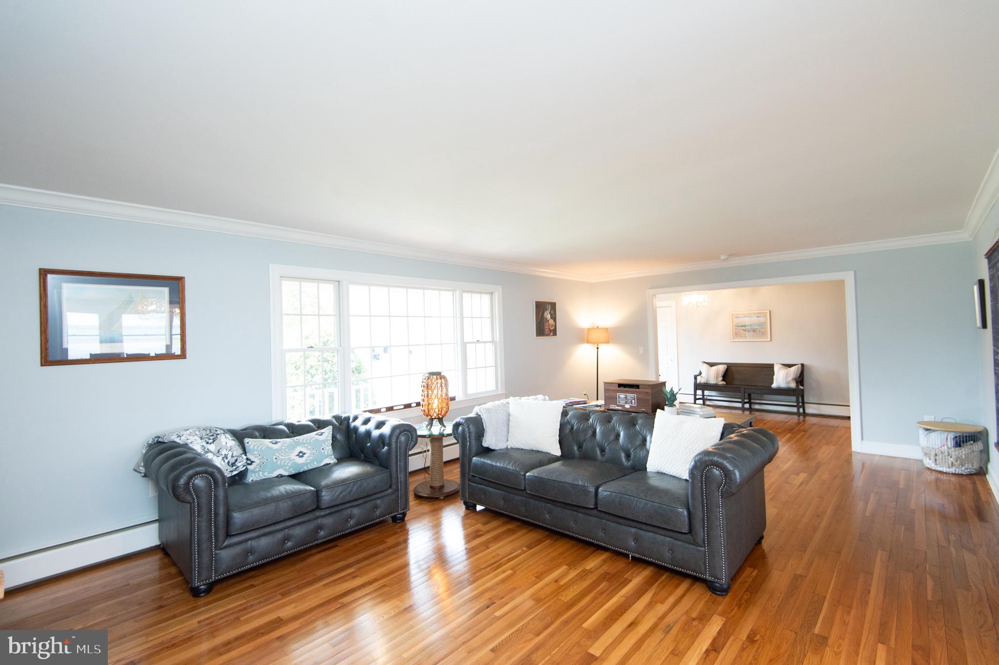1417 School Street Cambridge, MD 21613 - Photo 13 of 73 a living room with furniture and a wooden floor