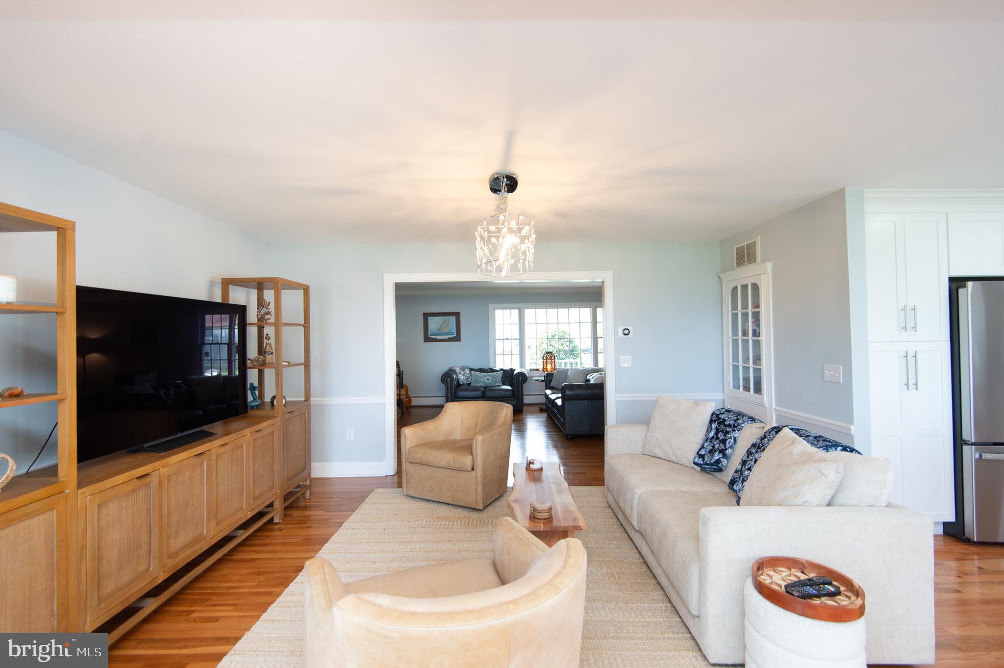1417 School Street Cambridge, MD 21613 - Photo 19 of 73 a living room with furniture and a flat screen tv
