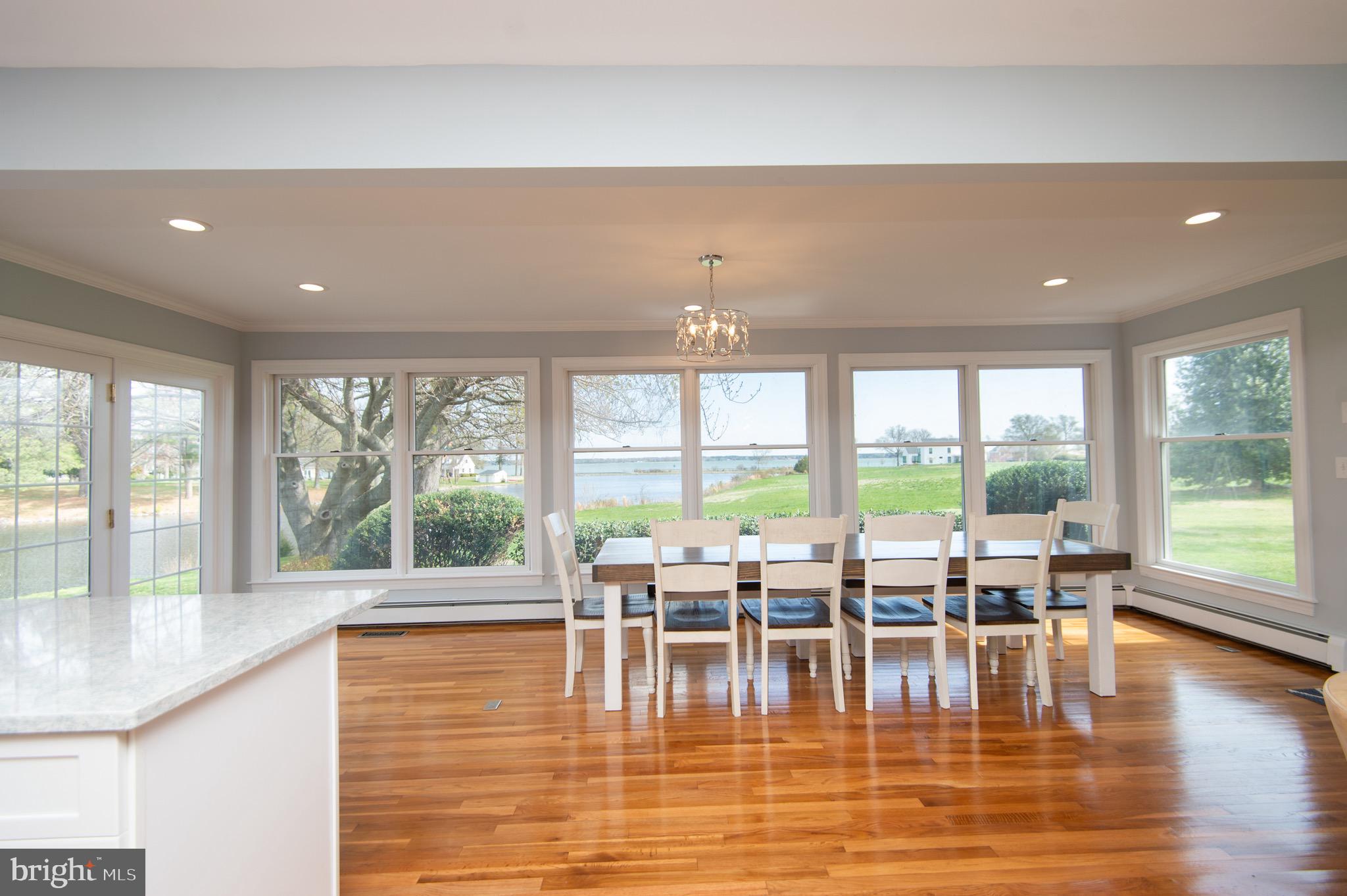 1417 School Street Cambridge, MD 21613 - Photo 25 of 73 a view of dining room with furniture and floor to ceiling windows