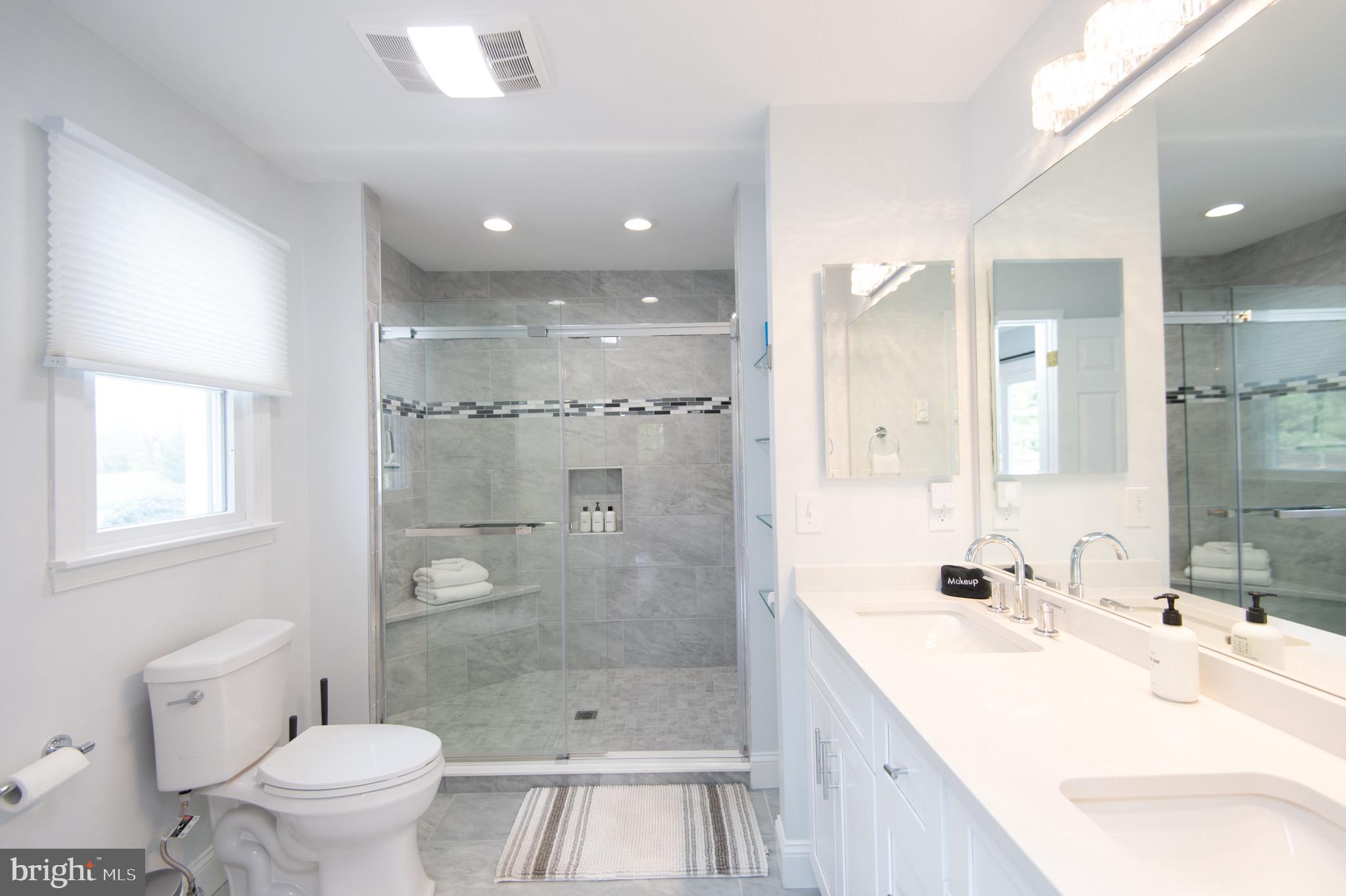 1417 School Street Cambridge, MD 21613 - Photo 37 of 73 a bathroom with a bathtub shower sink mirror and toilet