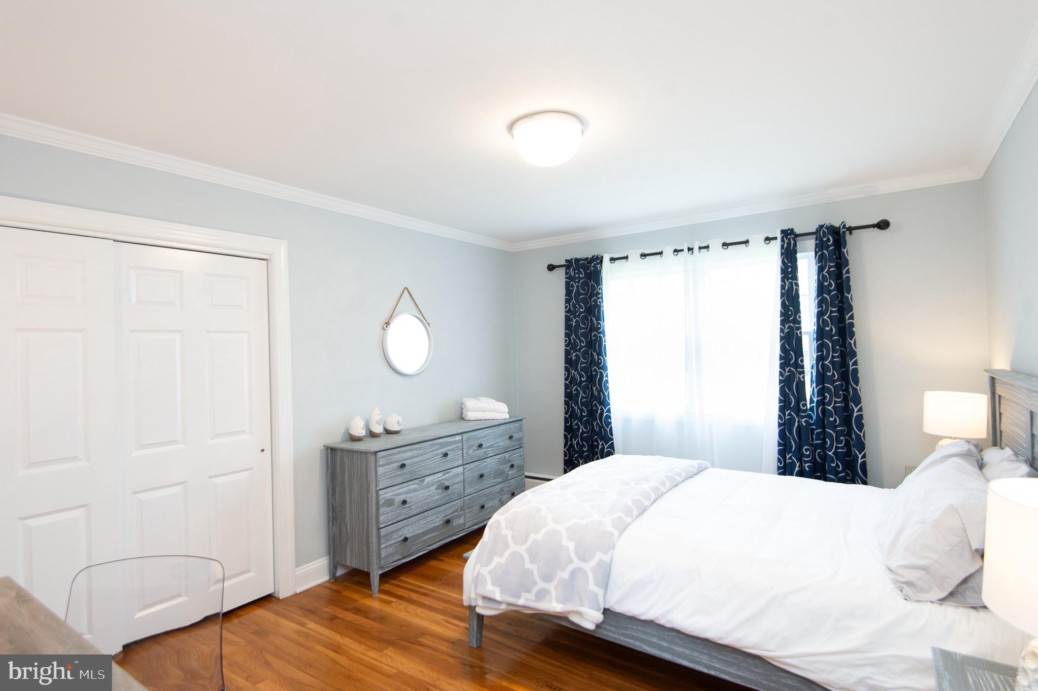 1417 School Street Cambridge, MD 21613 - Photo 38 of 73 a bedroom with a bed and a window