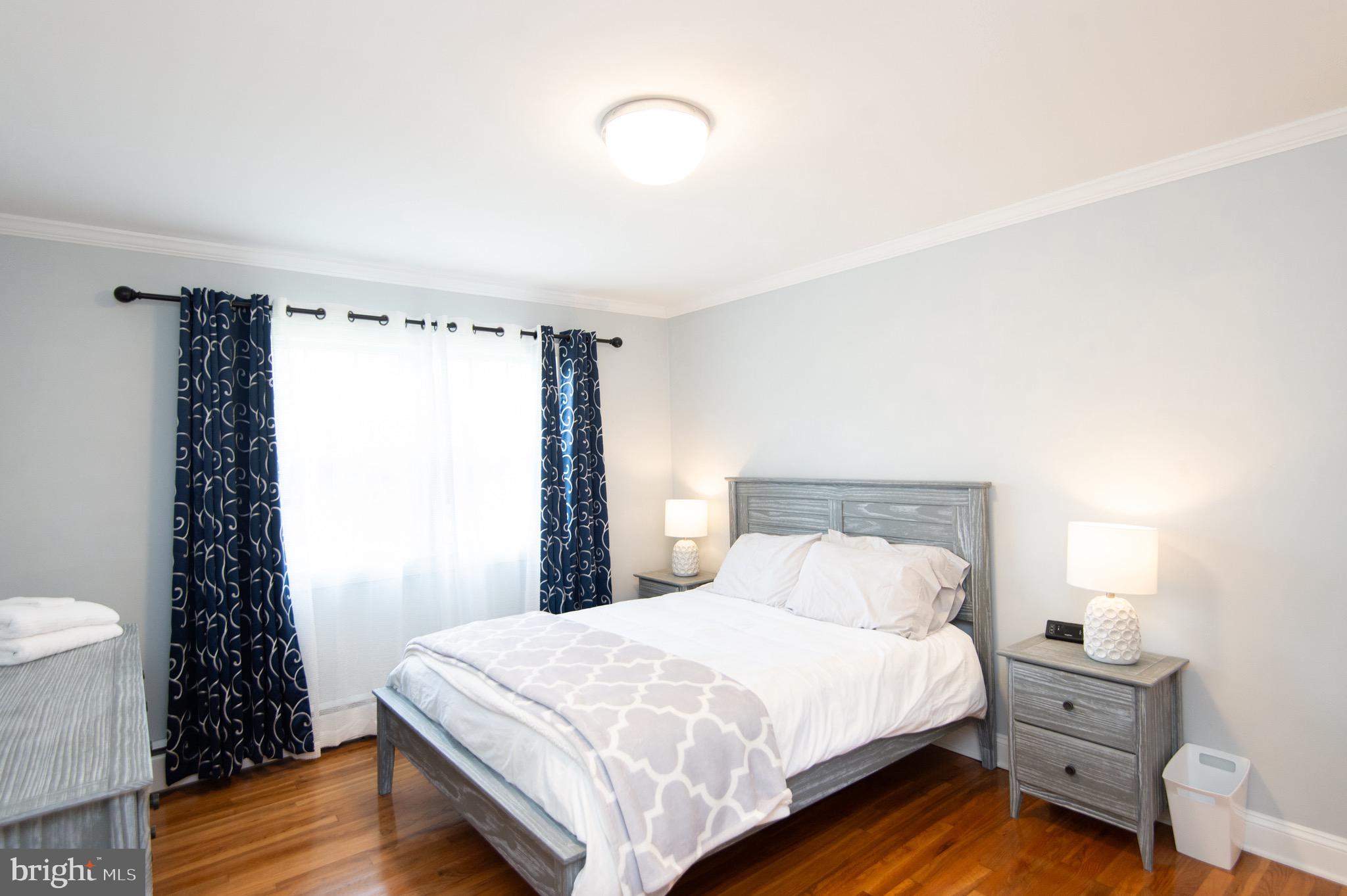 1417 School Street Cambridge, MD 21613 - Photo 39 of 73 a bedroom with a bed and a window
