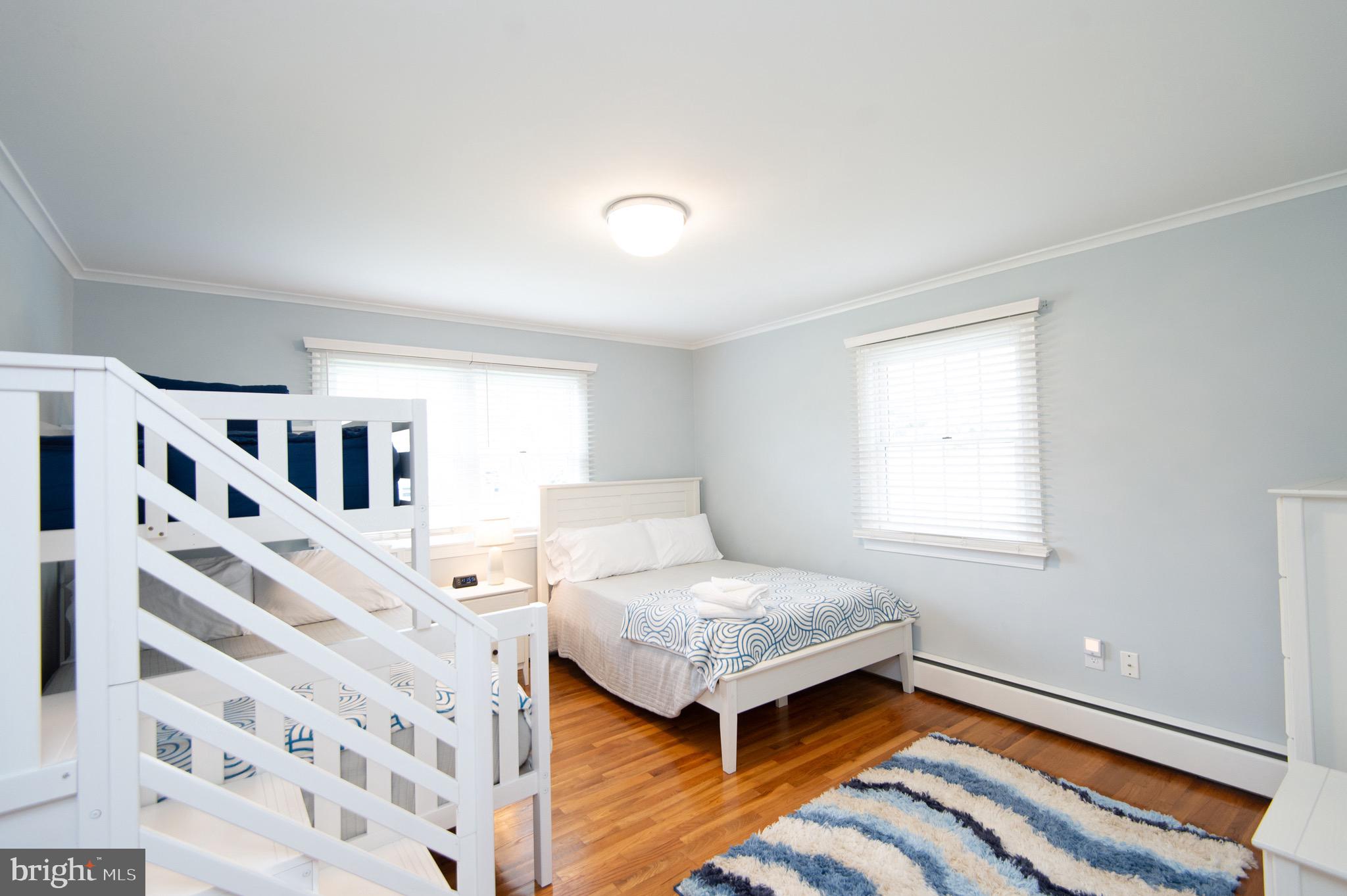 1417 School Street Cambridge, MD 21613 - Photo 42 of 73 a bedroom with a bed and a large window