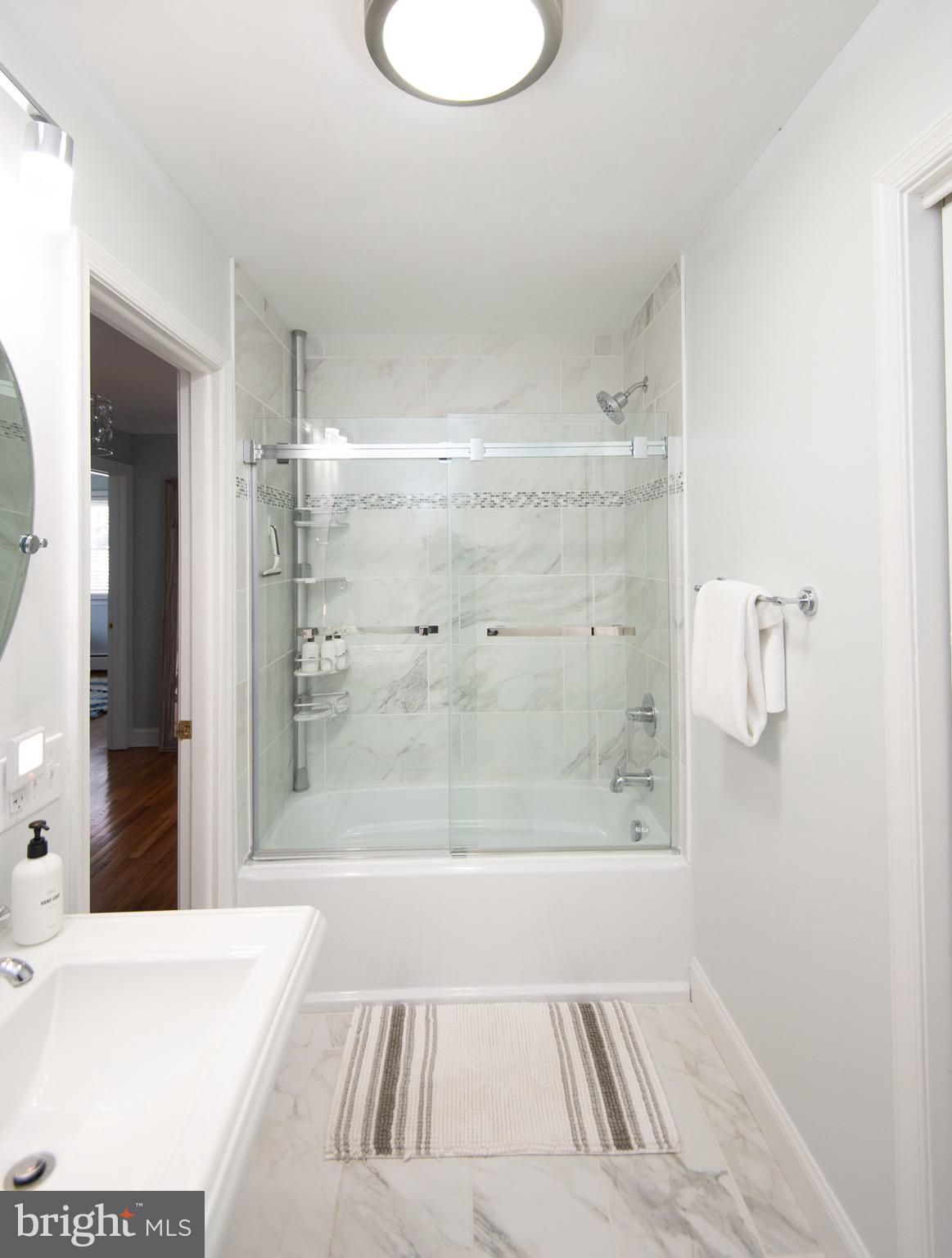 1417 School Street Cambridge, MD 21613 - Photo 46 of 73 a bathroom with a bathtub and shower