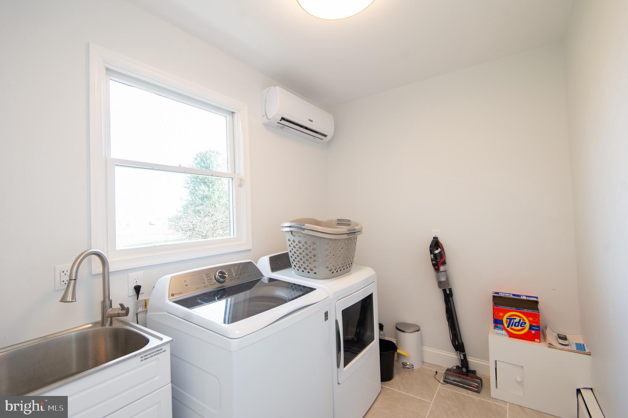 1417 School Street Cambridge, MD 21613 - Photo 50 of 73 a view of storage and utility room with washer and dryer