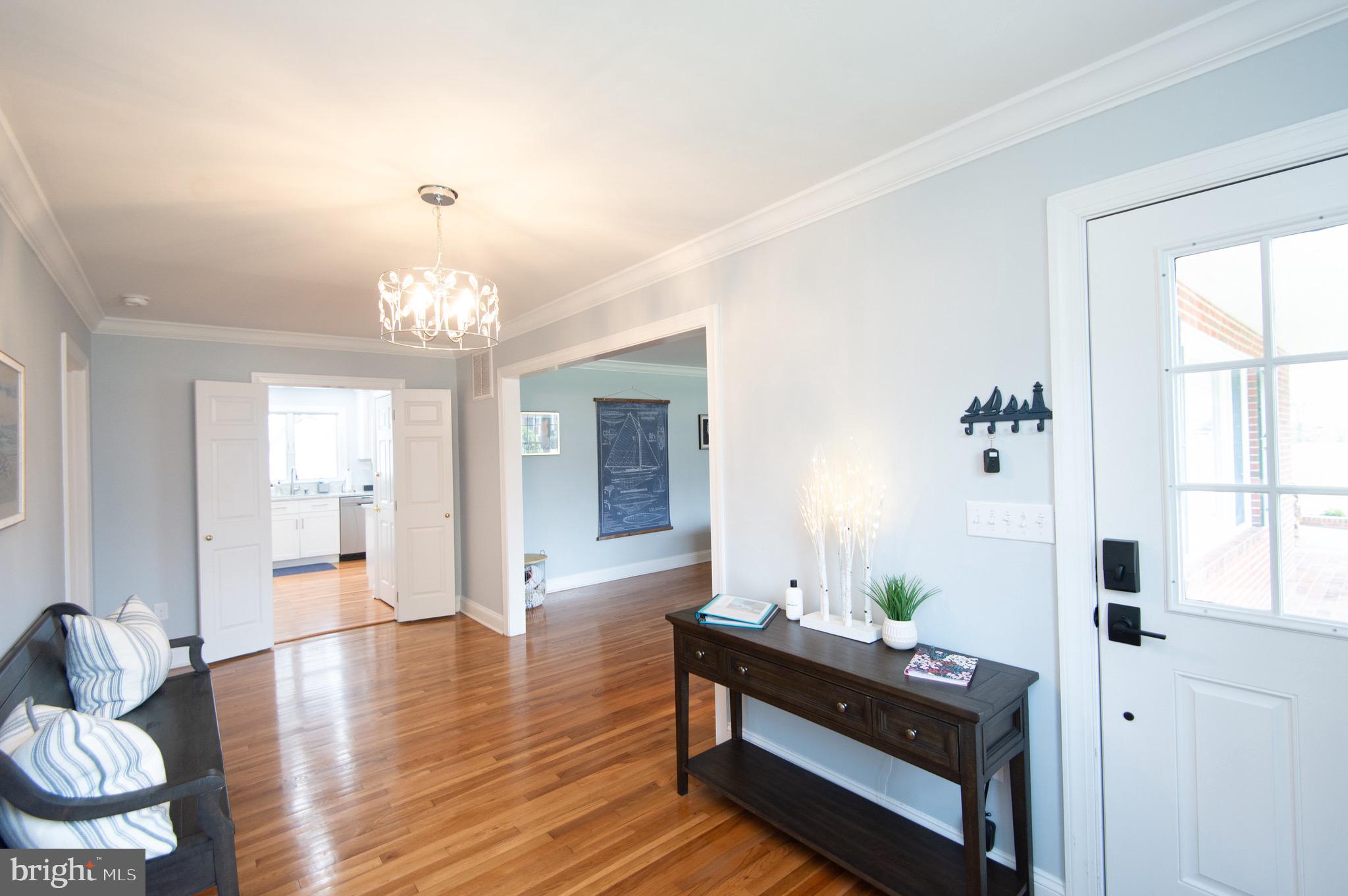 1417 School Street Cambridge, MD 21613 - Photo 5 of 73 a living room with furniture and a chandelier