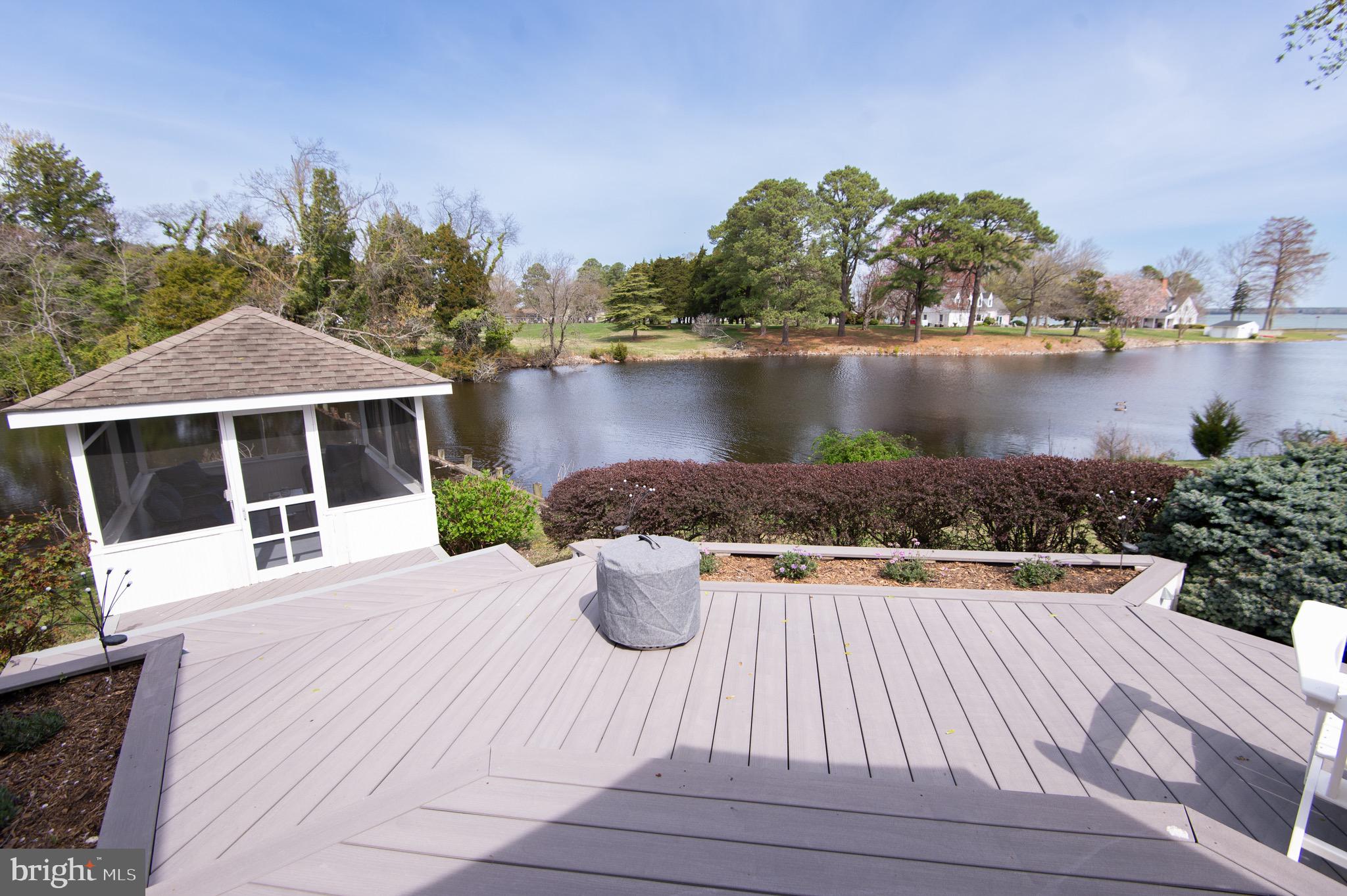 1417 School Street Cambridge, MD 21613 - Photo 58 of 73 a view of a white house with a yard and wooden floor