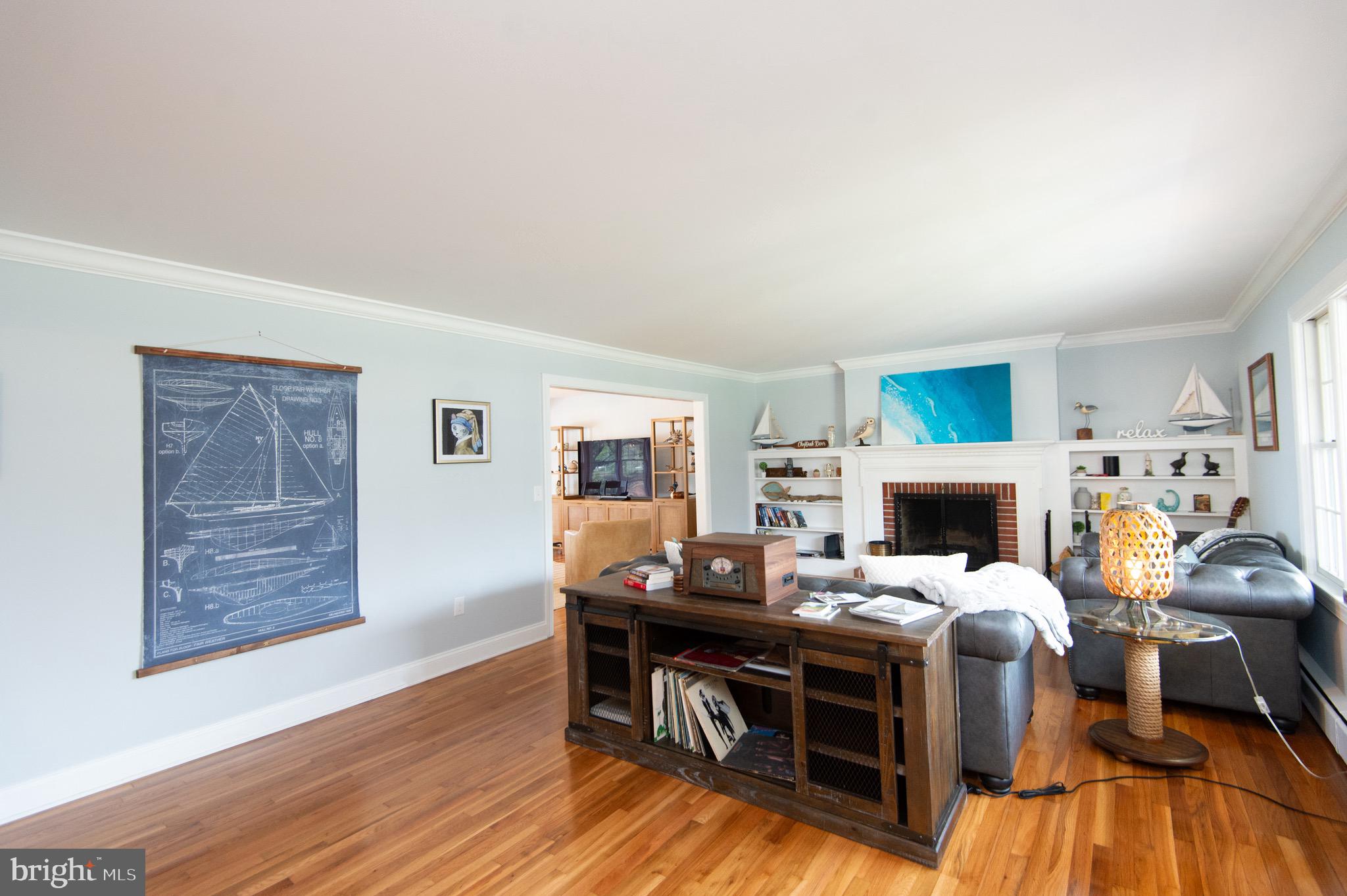 1417 School Street Cambridge, MD 21613 - Photo 9 of 73 a view of a livingroom with furniture and a fireplace