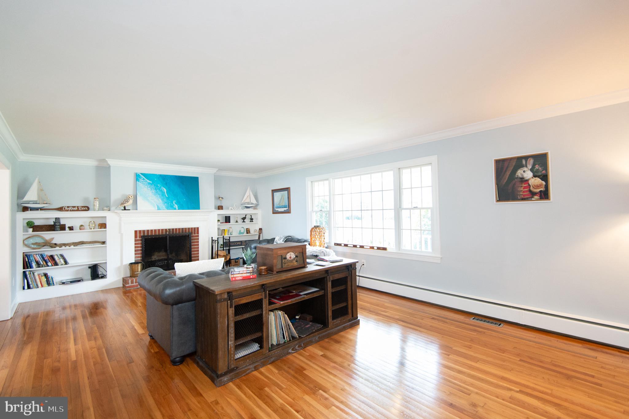 1417 School Street Cambridge, MD 21613 - Photo 10 of 73 a living room with fireplace furniture and a flat screen tv