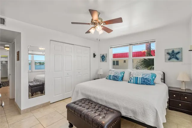 a bedroom with two beds and a window