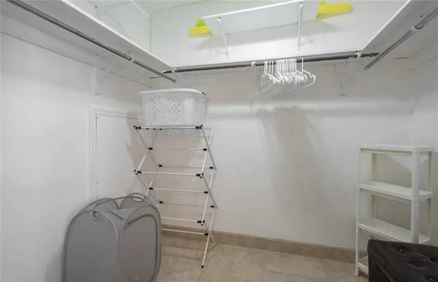 a room with furniture a air conditioner and a window