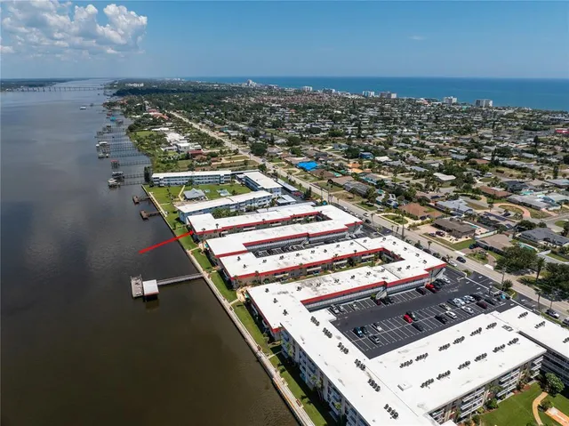 a kitchen with cabinets stainless steel appliances and a counter space