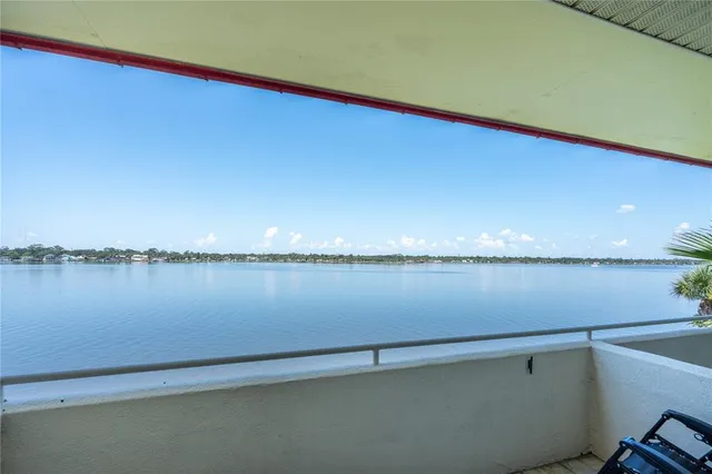 a view of a balcony with chairs
