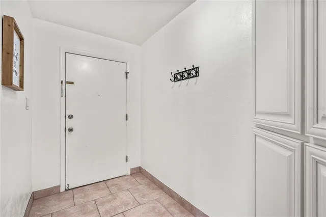 a view of swimming pool with outdoor seating and a potted plant