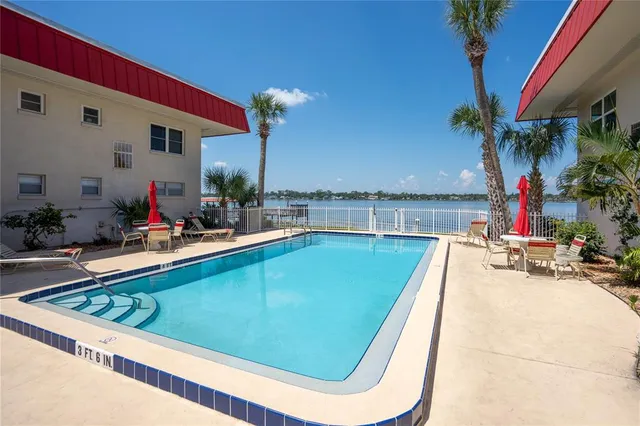 a view of a backyard with a table and chairs