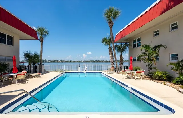 a view of a patio with swimming pool