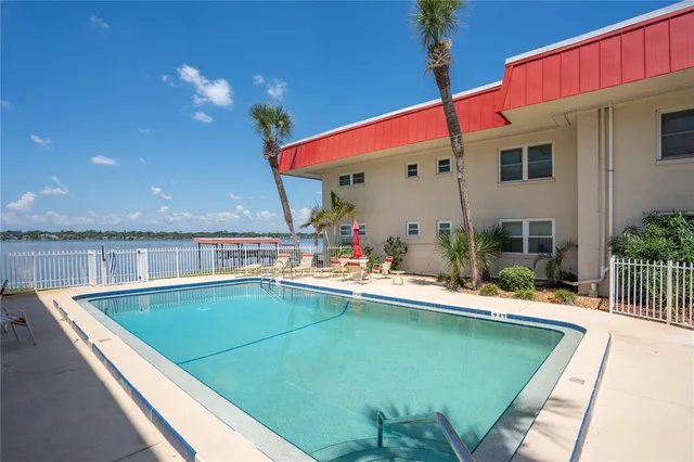 a view of a house with swimming pool