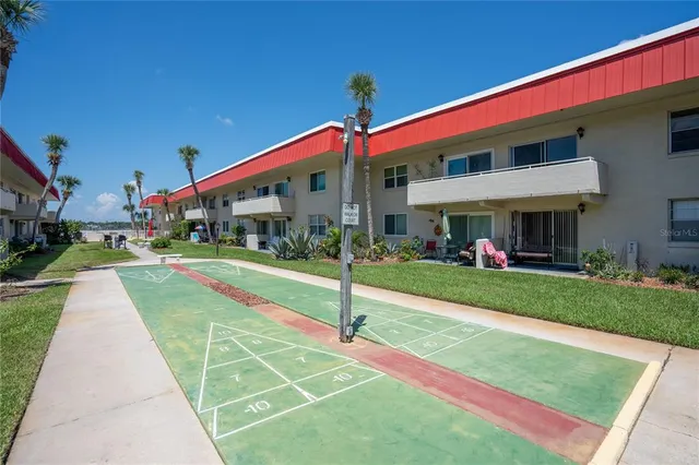 a view of an buildings with swimming pool and garden