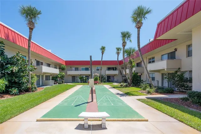 a view of a backyard with swimming pool